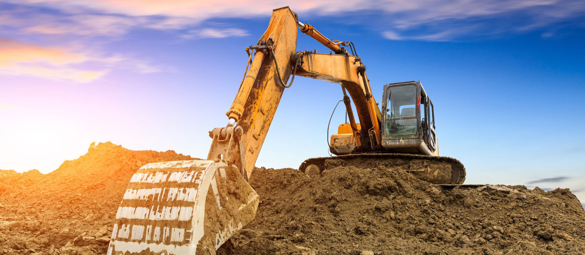 Excavator digging dirt